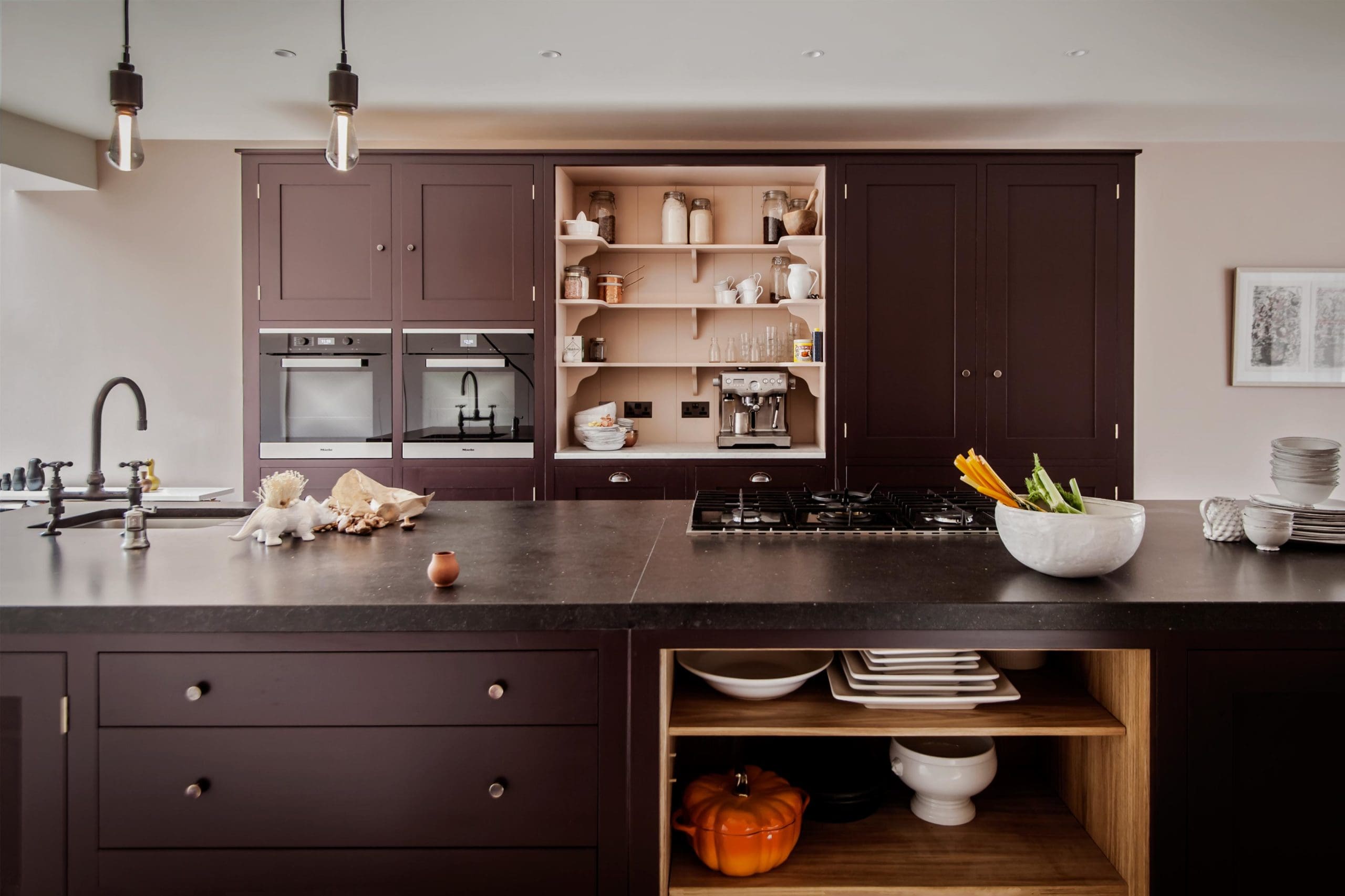  Osea Oak lined Island with Belgian Fossil Stone Worktop in the Highbury Barn. Honed Carrara Marble worktop. Open pantry.