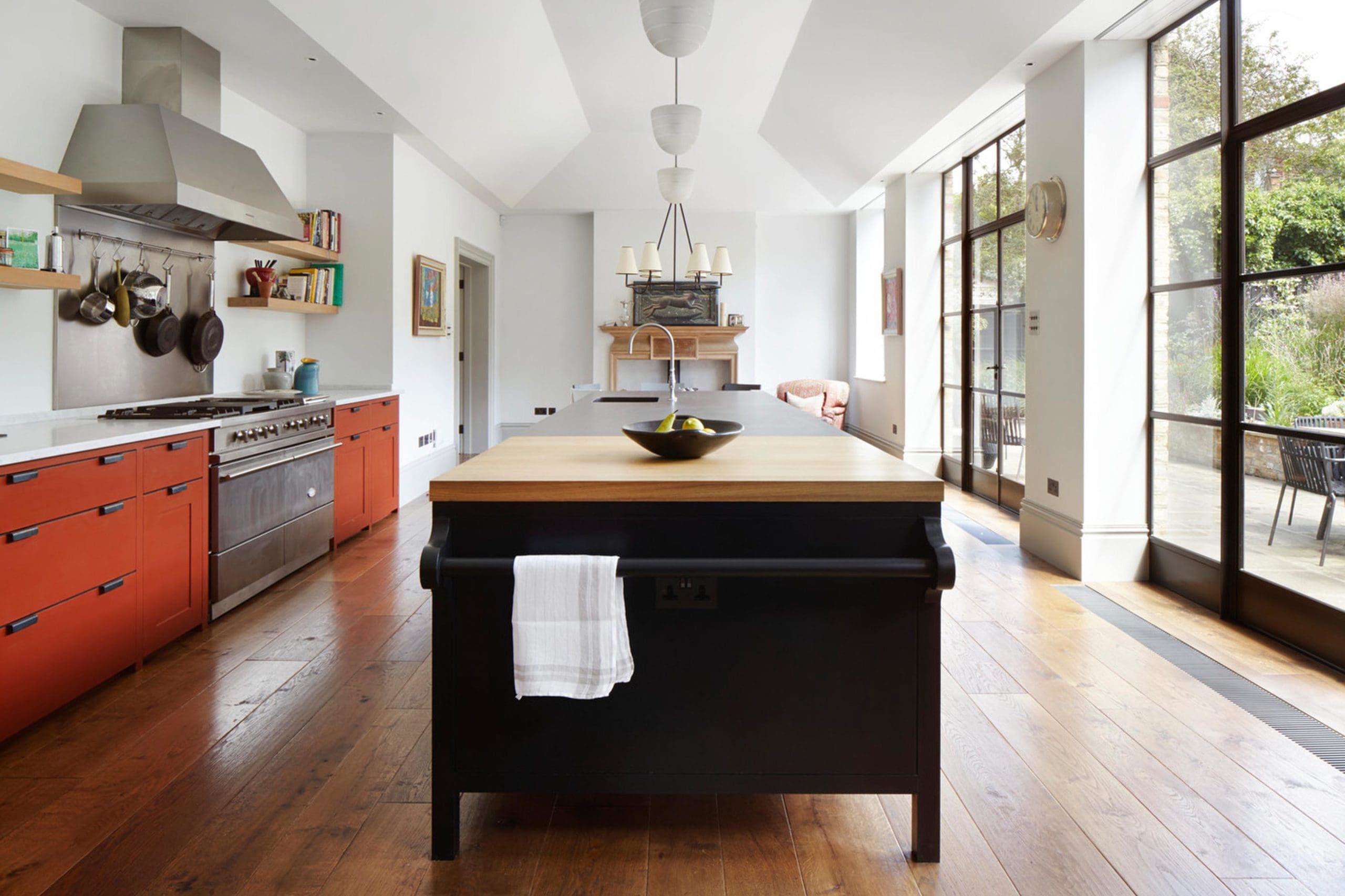  Long kitchen with centre work surface and orange units